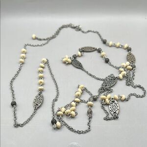 American Eagle Silver and Cream Necklace with Ornate Details